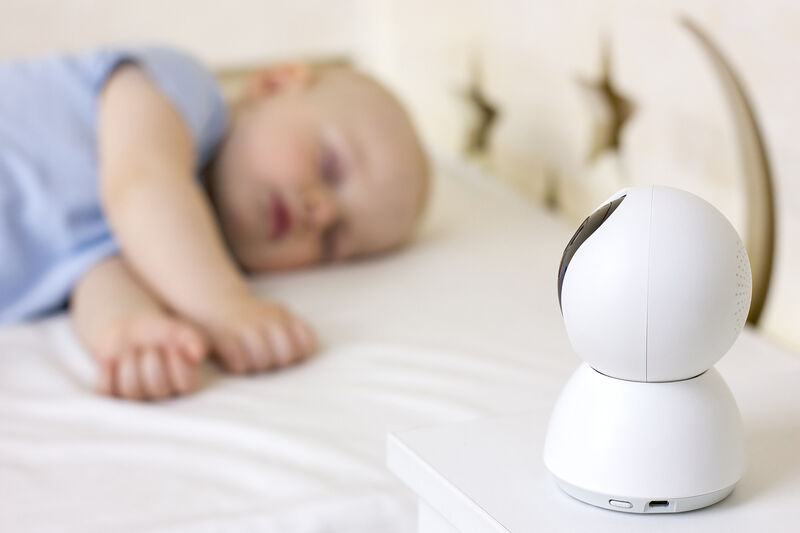 Baby sleeping, baby monitor in the foreground.