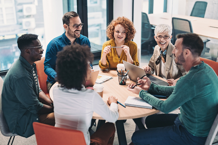 Businesspeople collaborating around a table.